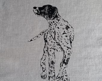 May include: Black and white illustration of a German Shorthaired Pointer dog standing on a gray linen background.
