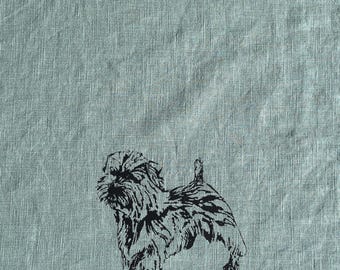 May include: A black and white illustration of a small dog on a light blue linen background.