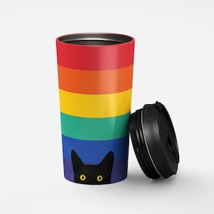 May include: A rainbow-colored stainless steel travel mug with a black cat peeking out from the bottom. The mug has a black lid with a silver band.