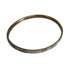 May include: A gold-toned bangle bracelet with rectangular mother-of-pearl inlays. The bracelet has a simple, elegant design, suitable for everyday wear. The bracelet is a classic piece of jewelry.