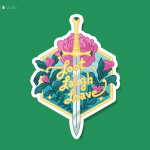 May include: A sticker with a sword design. The sword is centered, with a gold hilt and a silver blade. The words "Loot Laugh Leave" are written in a cursive font. Pink flowers and teal leaves surround the sword, set against a teal and gold background.
