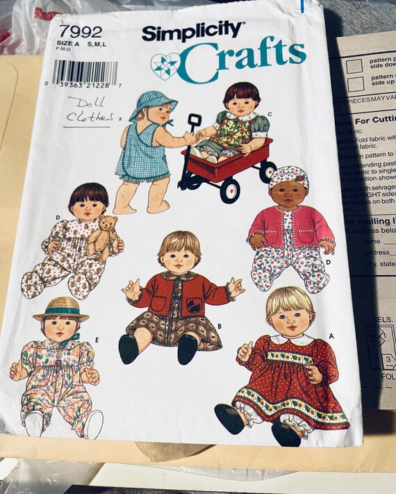 Simplicity 7992 doll wardrobe pattern  12 to 22 inches used several cut most uncut stored in Manila envelope
