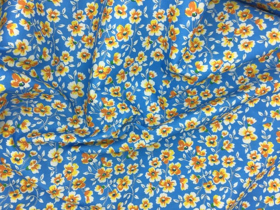Depression 20s 30s feedsack print 100% cotton fabric. RKFlowerhouse 30s collection by Debbie Beaves. Orange floral on blue. Sold by the yard