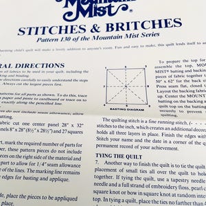 May include: A white paper instruction sheet titled Mountain Mist STITCHES & BRITCHES Pattern 130 of the Mountain Mist Series. The document features dark blue text, a basting diagram with numbered corners, and detailed quilting directions in inches.
