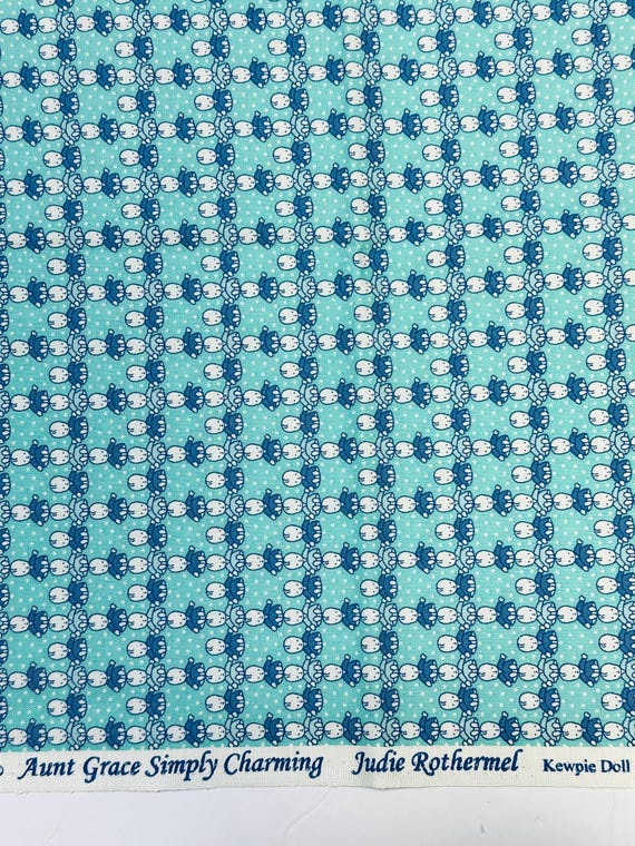 Depression 20s 30s feedsack print 100% cotton. Judie Rothermel Aunt Grace Simply Charming “Kewpie Doll” teal baby doll. Sold by the yard.