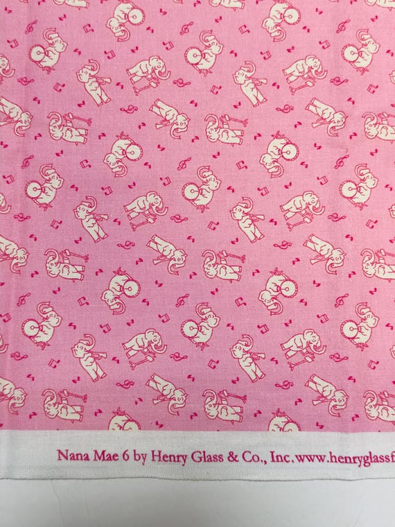 20s depression feedsack print 100% cotton. Henry Glass & Co Nana Mae 6 pink musical elephants. Sold by the yard.