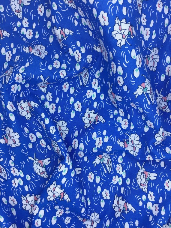 Depression 20s 30s feedsack print 100% cotton RJR Studio E.B.T.K.S XV. Dark Blue Bunny in boat.  Sold by the yard.