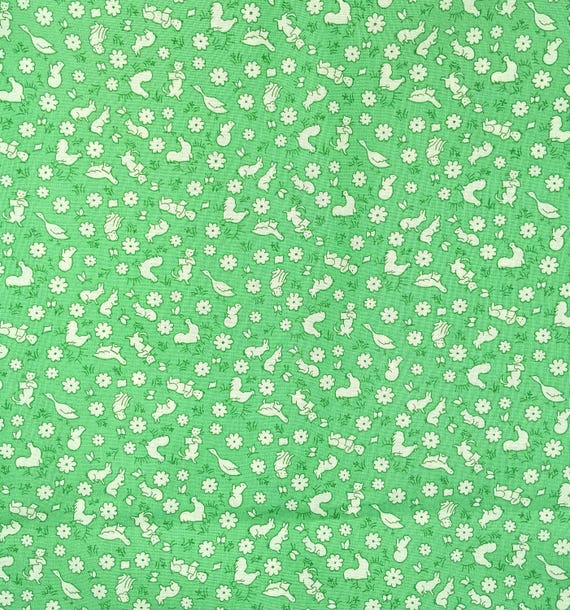 Depression 20s 30s feedsack print 100% cotton RJR Studio Everything but the kitchen sink. White animals/flowers on green. Sold by the yard.