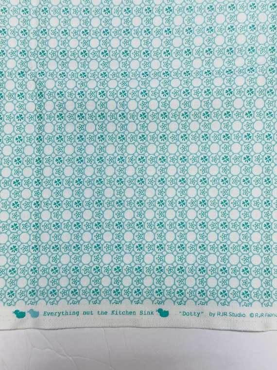 Depression 20s 30s feedsack print 100% cotton RJR Studio Everything but the kitchen sink teal geometric flowers “dotty” . Sold by the yard.