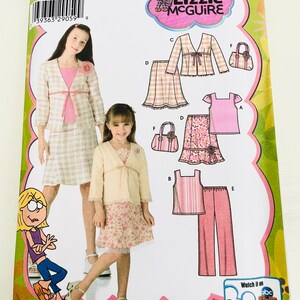 May include: A Simplicity 4669 sewing pattern envelope for Lizzie McGuire clothing, size K5 7-14. The cover features illustrations of a jacket, skirt, top, pants, and handbag, alongside photos of two models wearing the garments in plaid and floral prints.