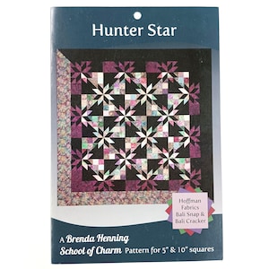 May include: A quilt pattern titled "Hunter Star" by Brenda Henning. The cover displays a quilt design with star patterns in purple, black, and white. The pattern is for 12.7cm and 25.4cm squares.