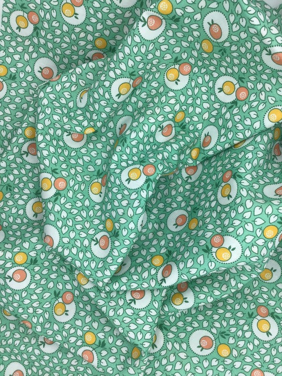 Depression 20s 30s Feedsack print 100% cotton fabric. RK “Blast from the past”  by Darlene Zimmerman. Green w/ tangerines. Sold by the yard.