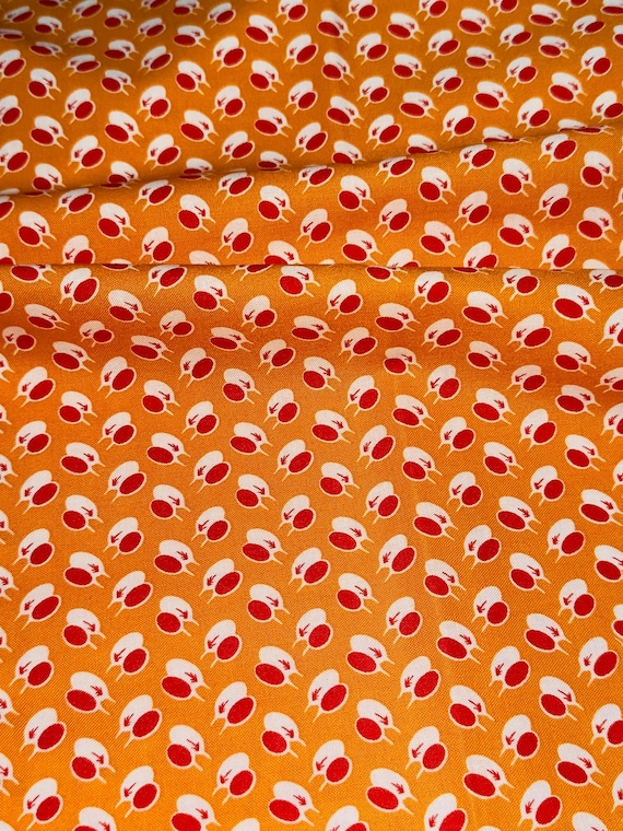 Depression 20s 30s feedsack print 100% cotton. Judie Rothermel Aunt Grace Simply Charming “Tea Time” orange teacup print. Sold by the yard.