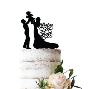 Wedding cake topper Bride and groom holding toddler Option for girl or boy toddler