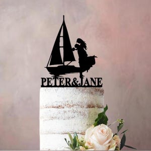 Bruidstaarttopper met zeilboot. Kies je eigen bruidspaar