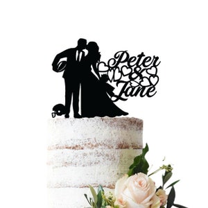 Wedding cake topper with groom playing rugby