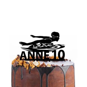 Birthday cake topper with a female swimmer doing the butterfly stroke, different variations and colours possible