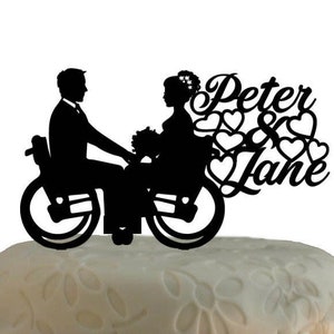 Wedding cake topper bride and groom in wheelchair