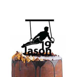 Birthday cake topper with a gymnast in the rings, different variations and colours possible