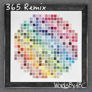 May include: Framed artwork featuring a colorful, circular design composed of small, square cross-stitch patterns. The design spans a spectrum of colors, from red to purple, with the text "365 Remix" at the top and "WorksByABC" at the bottom.