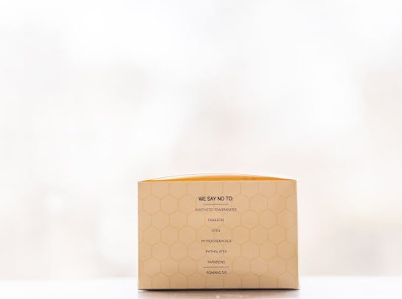 May include: A beige box with a honeycomb pattern and the text "We say no to: Synthetic fragrances, Parabens, Dyes, Petrochemicals & Phthalates, Parabens, Roman's 5.5."