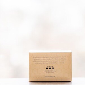 May include: A brown cardboard box with a honeycomb pattern and text that reads "Formulated with all-male loving skin natural ingredients starting with our organic hemp seed oil and rice bran. This results in a stronger, brighter and hyaluronic acid boost which purifies and scents the air while infusing a more iconic scent. Eat to any given space."