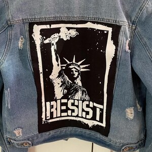 Anti-authority patch with Liberty graphic and resistance message.