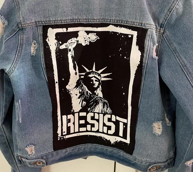 Anti-authority patch with Liberty graphic and resistance message.