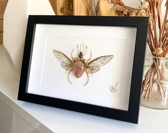 High-fashion insect embroidery in a frame