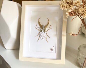 Haute couture insect embroidery in frame