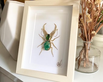 High-fashion insect embroidery in a frame