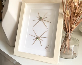 High-fashion insect embroidery in a frame