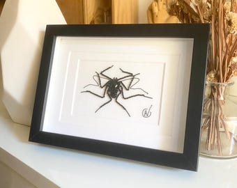 High-fashion insect embroidery in a frame