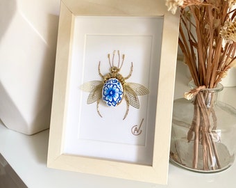 Haute couture insect embroidery in frame