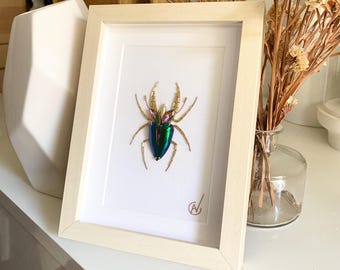 High-fashion insect embroidery in a frame