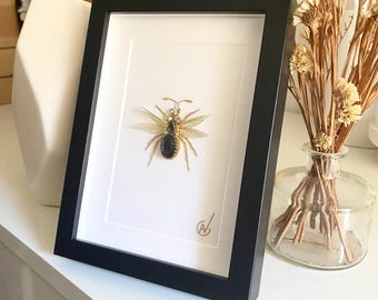 High-fashion insect embroidery in a frame
