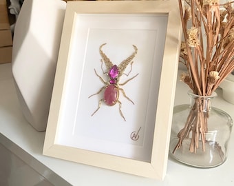 High-fashion insect embroidery in a frame
