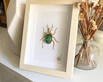 High-fashion insect embroidery in a frame
