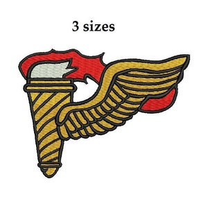 May include: A gold and red embroidered patch with a torch and wings. The torch has a red flame and a white center. The wings are gold with black outlines. The patch says "3 sizes" at the top.