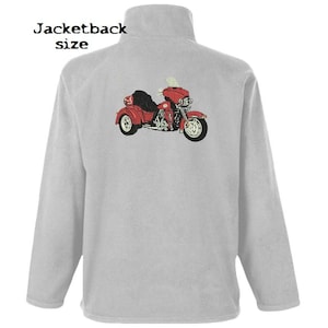 May include: A grey fleece jacket with a red, white and black trike motorcycle embroidered on the back. The motorcycle has a sidecar and a windscreen.