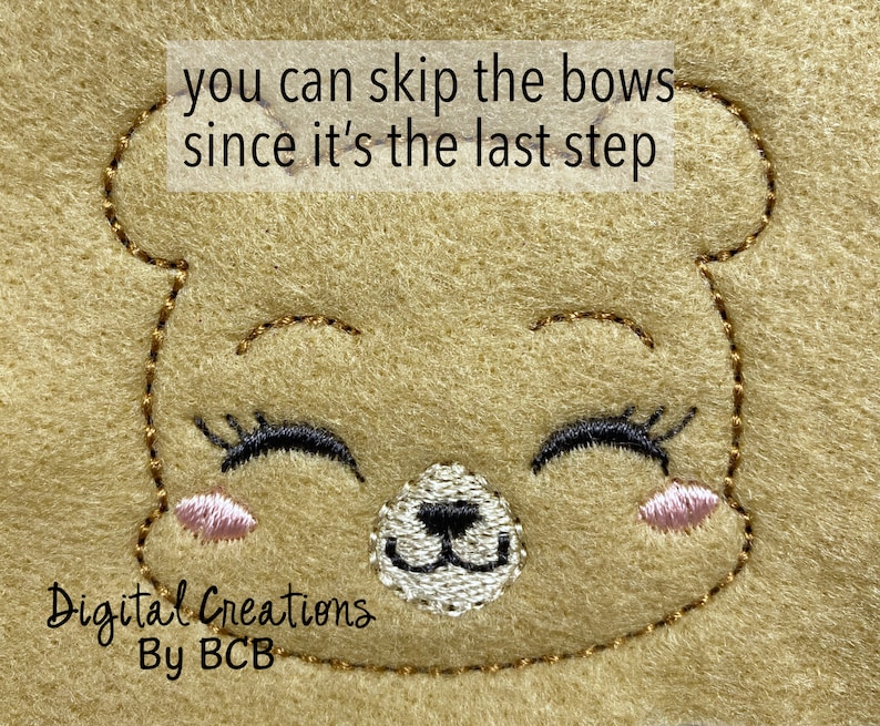 May include: Close-up of a tan felt bear face with embroidered details. The bear has closed eyes with black eyelashes, a white nose, and pink cheeks. The text "you can skip the bows since it's the last step" is at the top. The text "Digital Creations By BCB" is at the bottom.