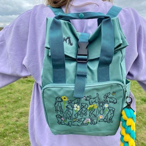 Spring Dogs backpack for dog lovers and owners. Colourful embroidered compact rucksack take on all your spring/ summer adventures. Recycled