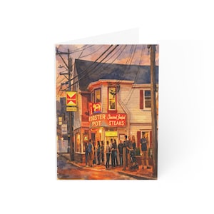 May include: Greeting card with a watercolour painting of a restaurant at dusk. The sign reads "Lobster Pot Steaks". People are gathered outside the restaurant. The sky is a mix of orange and purple.