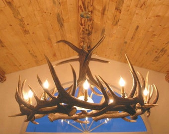 The Ghost Faux Elk Antler Chandelier Rustic Antler Light Pendant 55" Wide by 32" Tall  Individually Handcrafted For Excellence