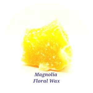 May include: A close-up of a yellow block of magnolia floral wax.