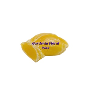 May include: A close-up of a yellow wax block with the text "Gardenia Floral Wax" printed on it.