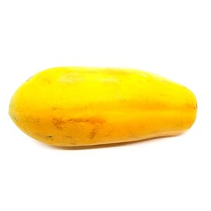 May include: A ripe yellow papaya isolated on a white background.