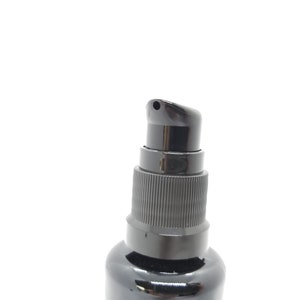 May include: A black pump bottle with a black cap and a small nozzle.