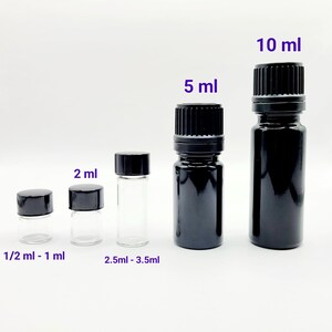 May include: Five glass bottles with black caps, ranging in size from 1/2 ml to 10 ml. The bottles are arranged from smallest to largest. The bottles are labeled with their respective sizes in milliliters.