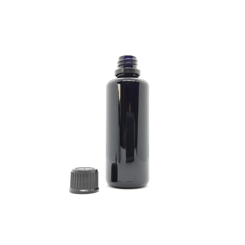 May include: A black glass bottle with a black screw-on cap. The bottle is empty and ready to be filled.